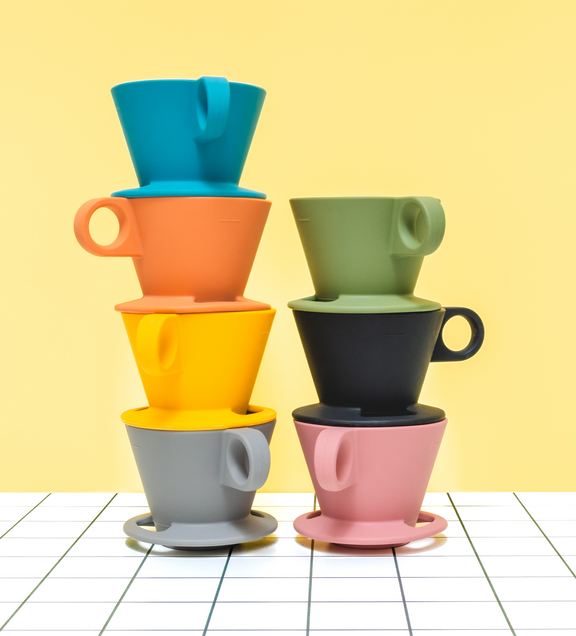 a stack of colorful coffee cups