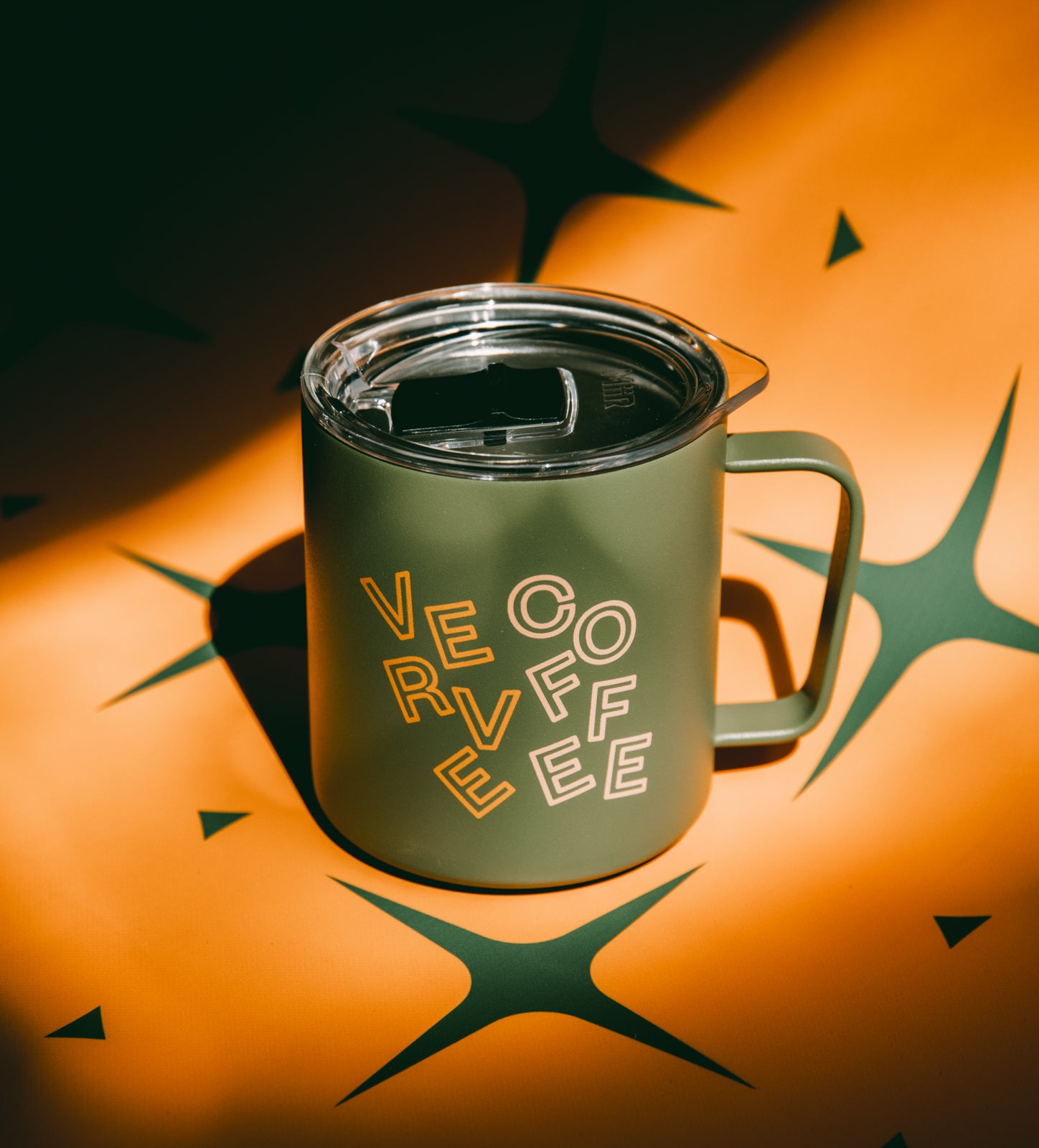 Evergreen Dream Camp Mug with holiday pattern background