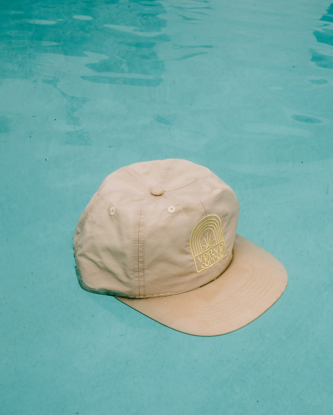Sunburst Stitch Cap styled on a pool